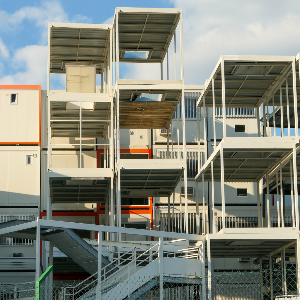 Multi-story modular buildings are manufactured in a controlled environment, delivered and 
